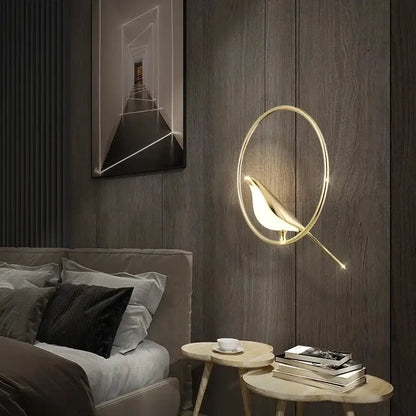 Modern gold magpie bird led chandelier featuring a gold-toned bird-shaped wall sconce with glowing interior light