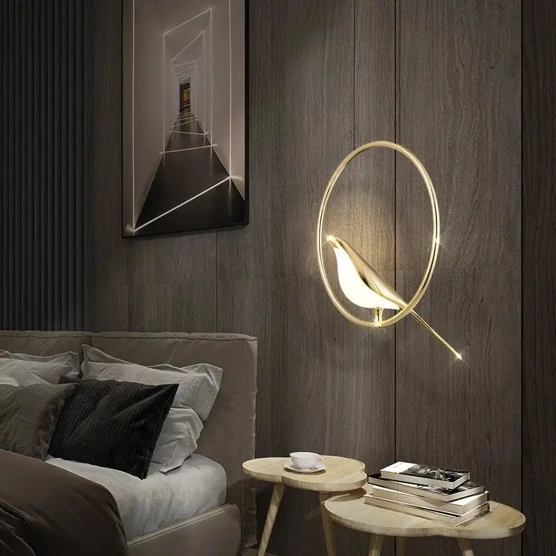 Modern gold magpie bird led ring chandelier features a gold-toned bird-shaped wall sconce with glowing interior light