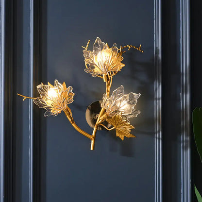 Modern gold maple leaf wall lighting fixture with clear glass and branching design for dining room lighting fixture