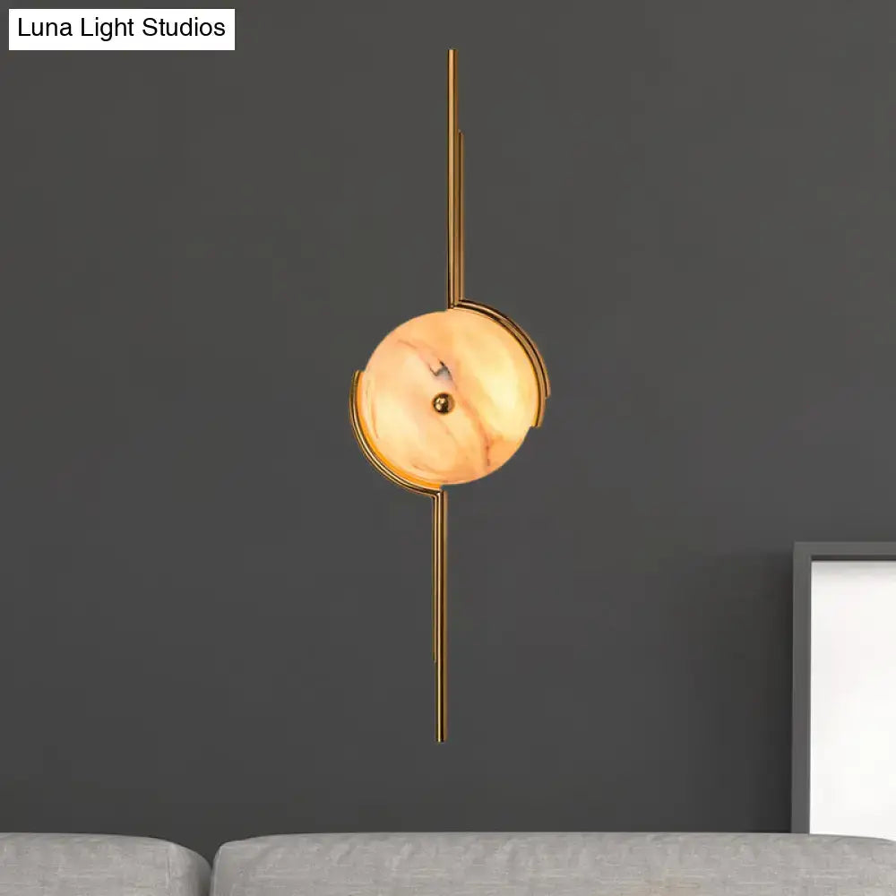 Modern gold marble led wall light featuring a gold-toned pendant light with a warm marble shade and slender rods