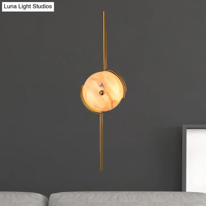 Modern gold marble led wall light featuring a gold-toned pendant light with a warm marble shade and slender rods