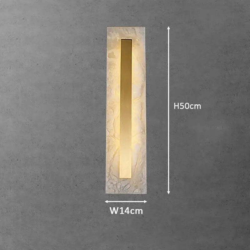 Modern gold marble living wall lamp with textured stone frame frosted glass and central gold metallic strip emitting warm light
