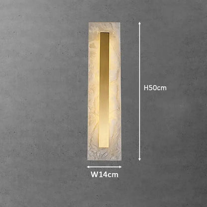 Modern gold marble living wall lamp with textured stone frame frosted glass and central gold metallic strip emitting warm light