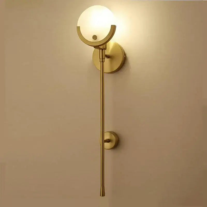 Modern gold marble wall light with frosted glass globe and sleek design for bedroom and living room decorbites gold marble wall lights