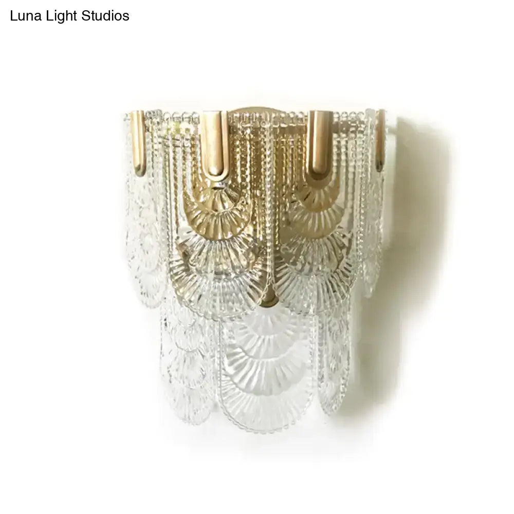 Clear glass chandelier with gold-toned metal accents and cascading fan-shaped design for 110v-120v wall light use