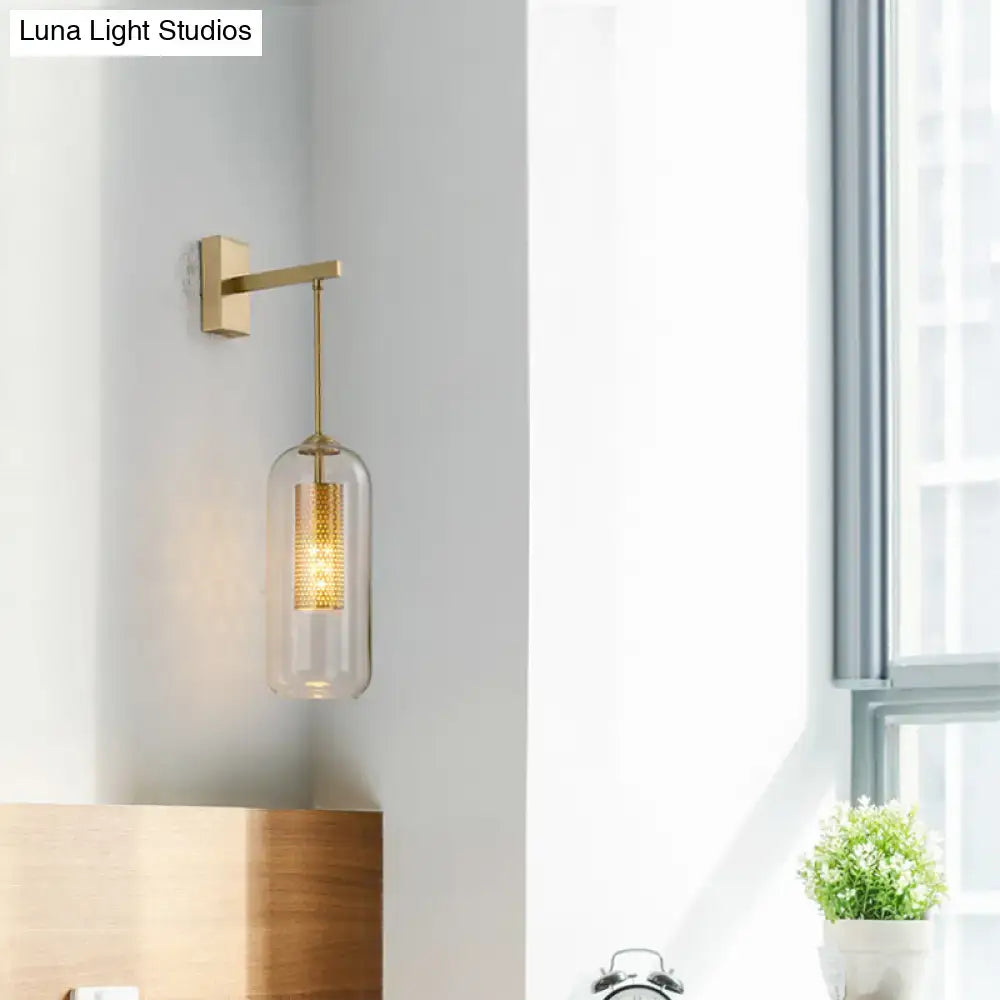Modern gold mesh clear glass sconce wall lamp with illuminated honeycomb pattern for stylish bedroom lighting