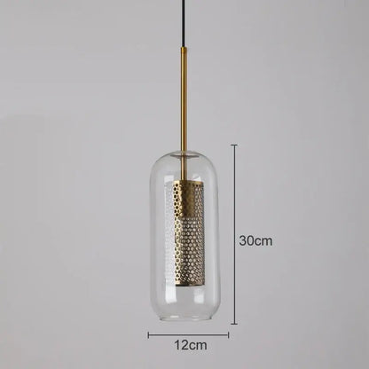 A modern pendant light with a clear glass dome and gold mesh glass perforated shade by decorbites gold mesh