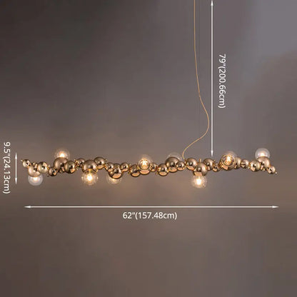 Modern gold metal arched ceiling light for dining room with six glowing bulbs and reflective spherical orbs design