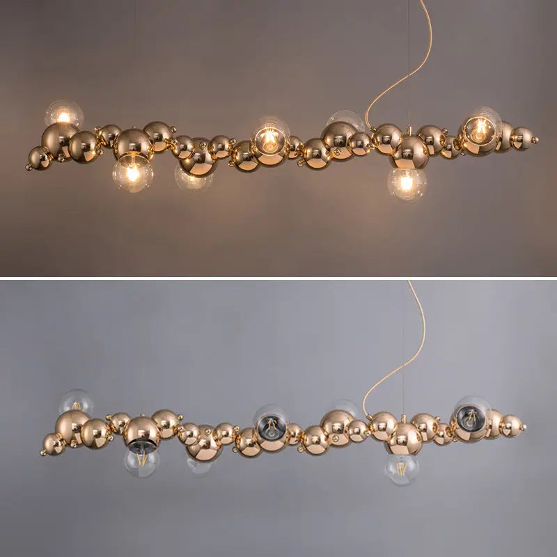 Modern gold metal arched ceiling light with six clear glass bulbs for dining room featuring a sleek spherical design
