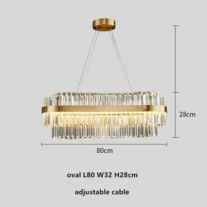 Modern gold metal crystal pendant light with gold-toned oval frame and cascading clear crystal prisms for dining room decorbites gold metal