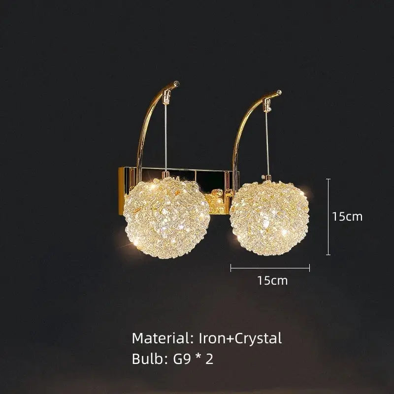 Modern gold metal crystal wall light featuring a gold-toned sconce with two spherical crystal clusters by decorbites gold metal