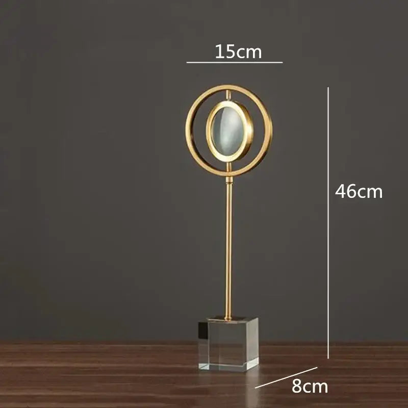 Modern gold metal magnifying glass with circular frame and glass base on elegant stand for decorbites golden metal decorbites golden metal decor