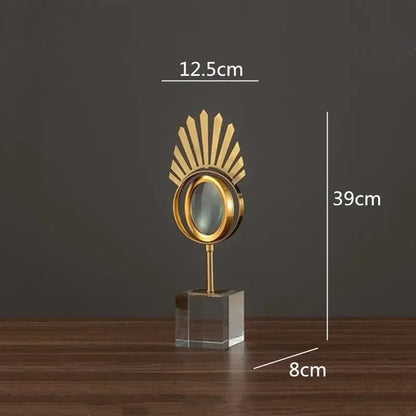 Modern gold metal magnifying glass with golden sunburst design and clear crystal glass base decorbites golden metal decor