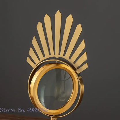 Modern gold metal magnifying glass with sunburst design and glass base for stylish living room decor by decorbites golden metal