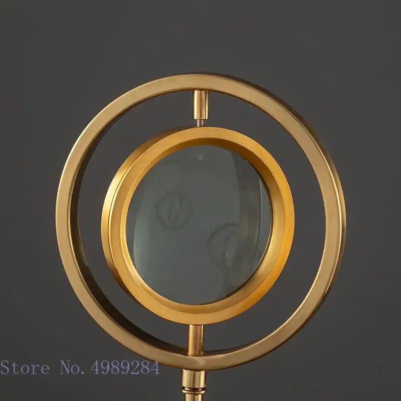Modern gold metal magnifying glass with glass base featuring elegant decorbites golden metal design for living room decor