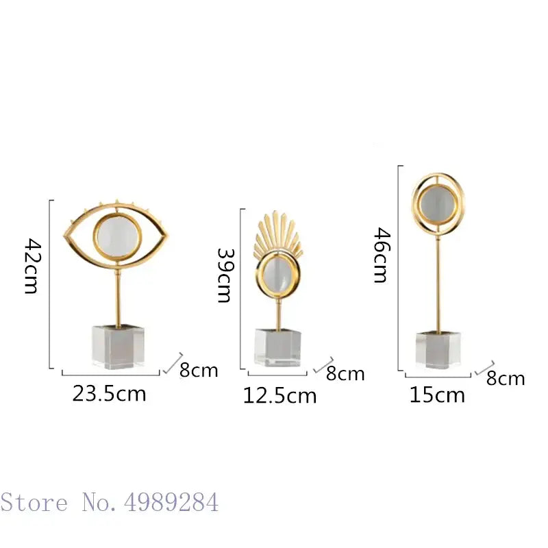 Modern gold metal eye magnifying glass with glass base and decorbites golden metal sunburst and circular frame decor