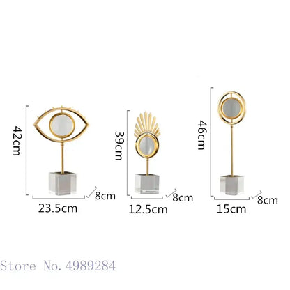 Modern gold metal eye magnifying glass with glass base and decorbites golden metal sunburst and circular frame decor