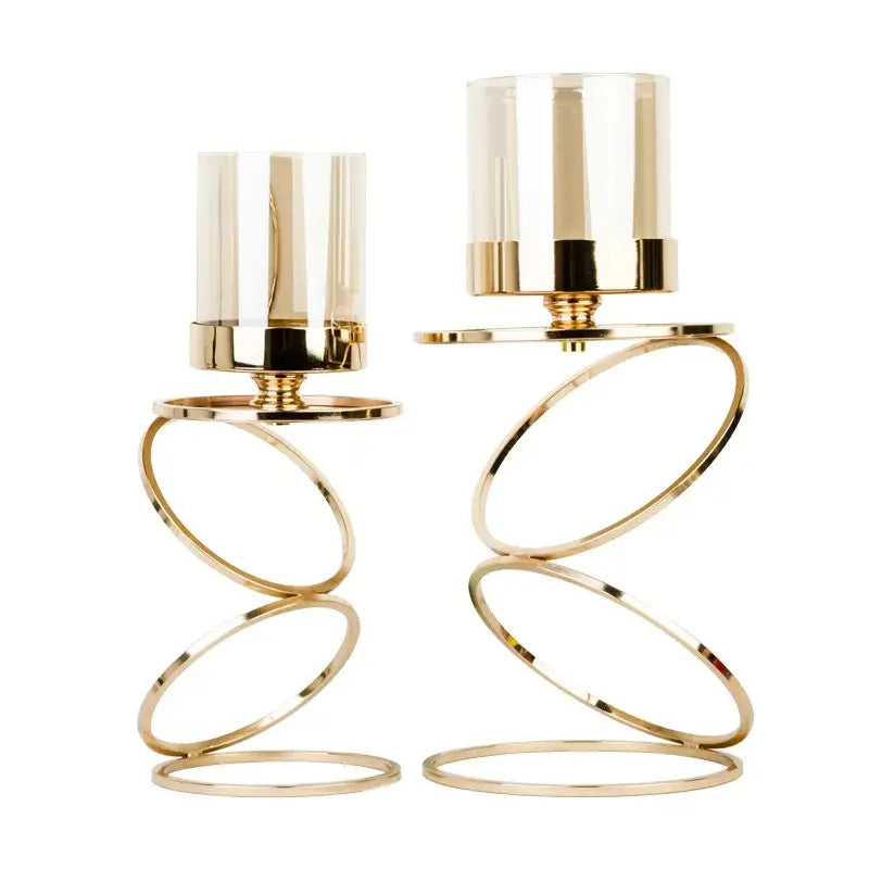 Modern gold metal frame candle holder with gold-toned metal spiral rings and clear glass cylinders decorbites gold metal decor