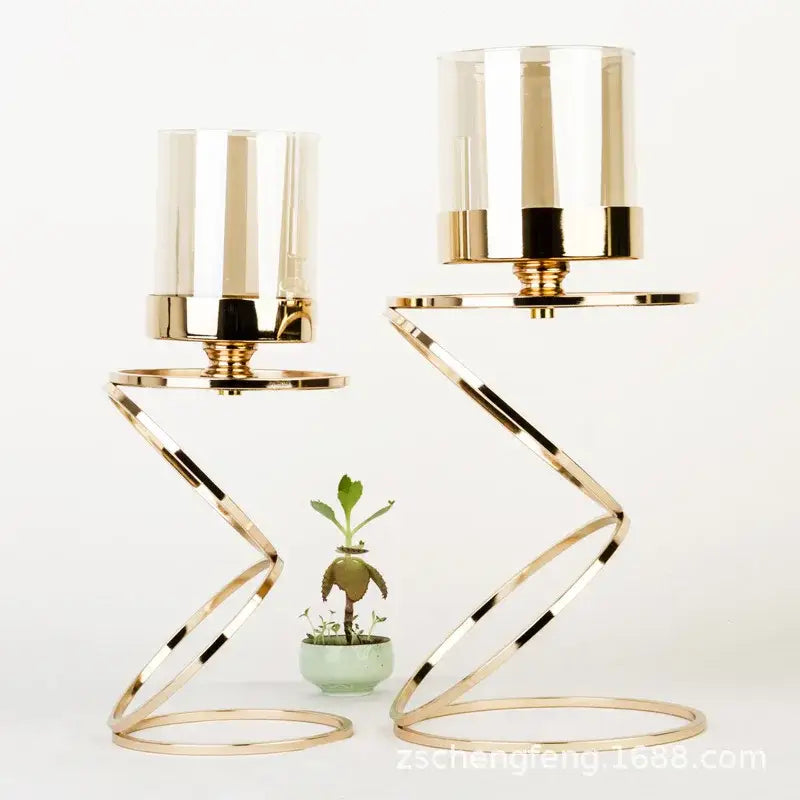 Modern gold metal frame candle holder with clear glass cylinders and zigzagged design for dining room decorbites gold metal