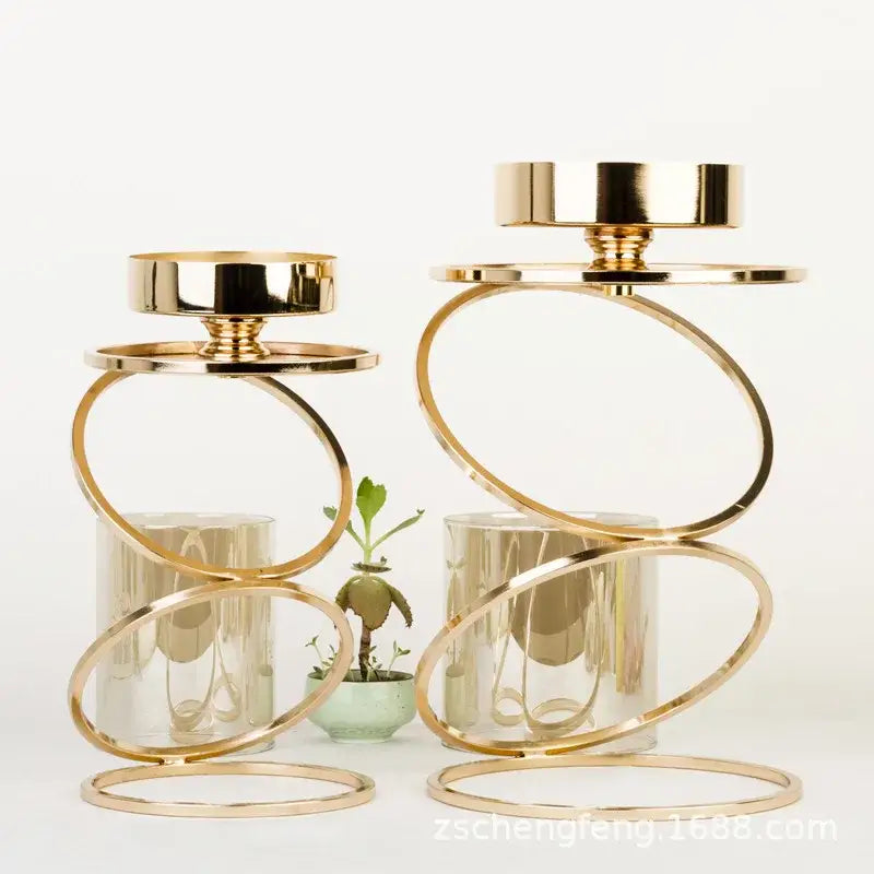 Modern gold metal frame candle holder with clear glass cylinders and circular ring design for dining room decorbites gold metal