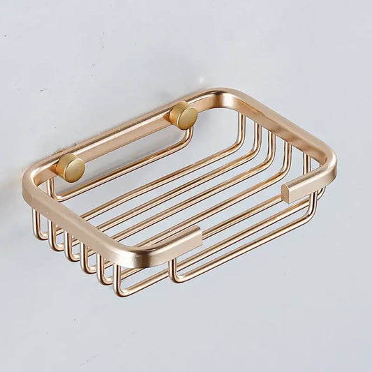 Modern gold metal glass soap dish with sleek rectangular design and rounded edges for bathroom wall mounted use