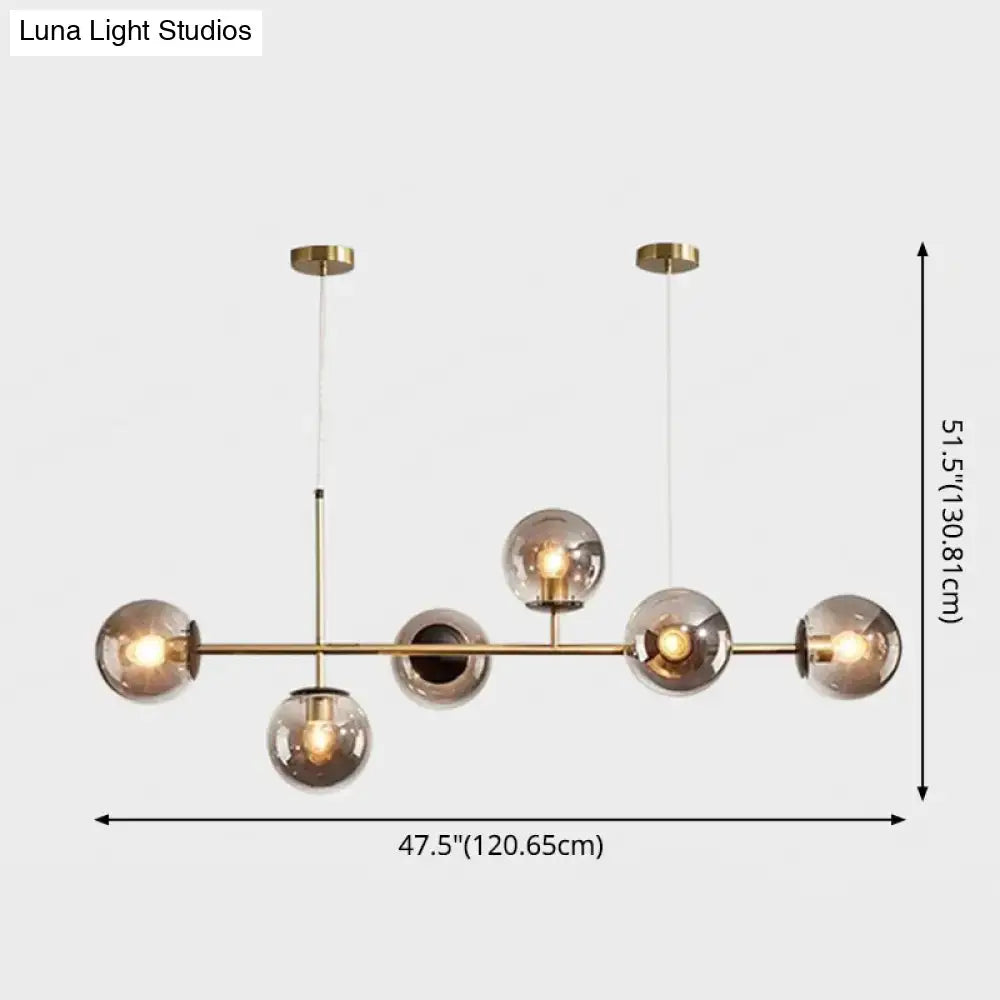 Modern gold metal island pendant chandelier with five smoked glass spherical bulbs for dining room lighting