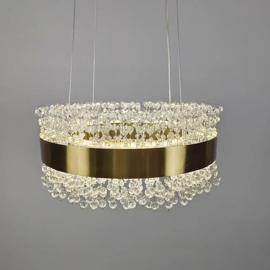 Modern gold metal led chandelier featuring a brushed gold band and cascading crystal droplets for dining room decorbites gold metal design