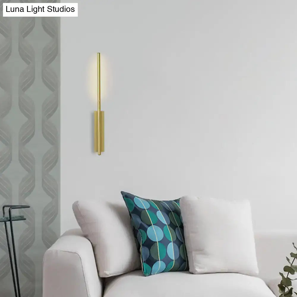 Modern gold metal linear wall light with a sleek vertical cylindrical design ideal for bedroom wall lamp lighting