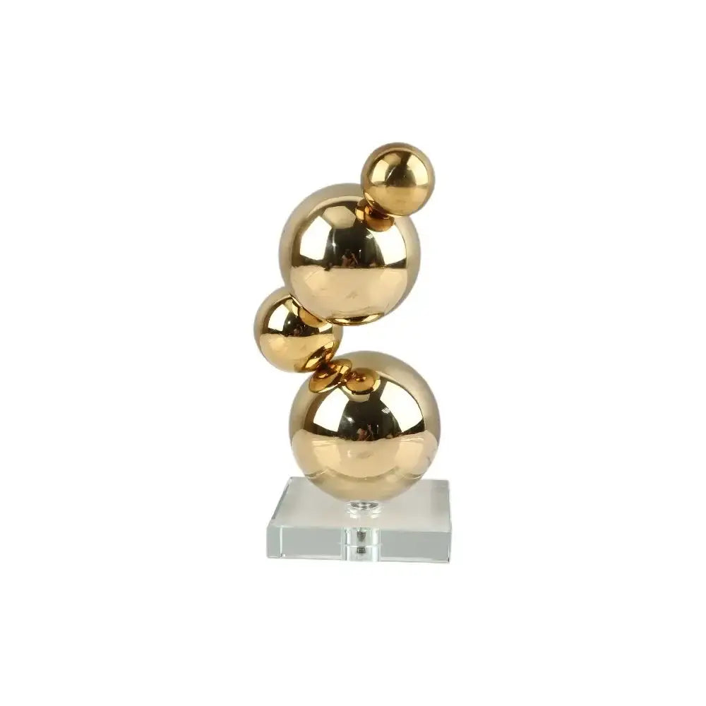 Modern gold metal spheres stacked art pieces on a clear acrylic base for elegant living room decor by decorbites gold metal