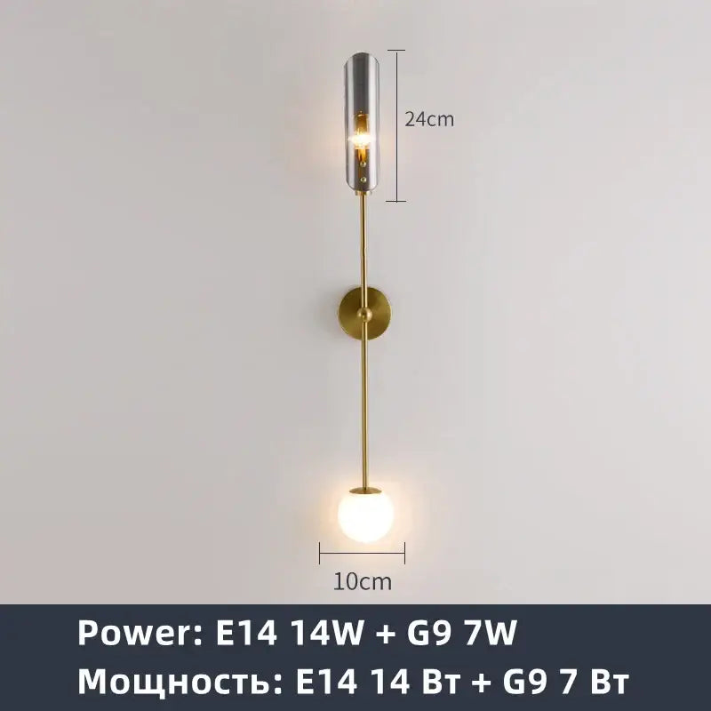 Modern gold metal wall sconce with sleek brass stem cylindrical chrome housing and exposed bulb for decorbites gold metal light