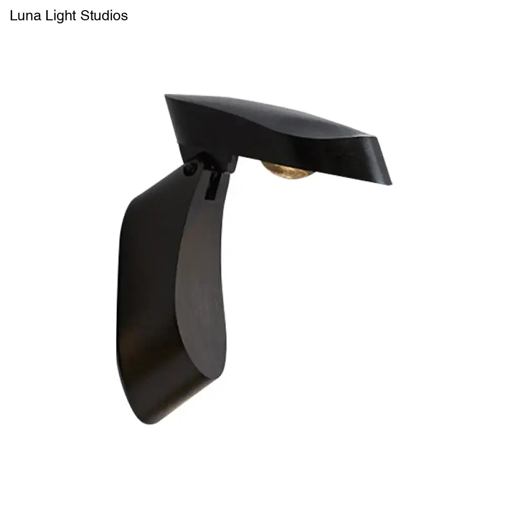 Modern gold metal wall light with black matte finish and sleek design for bedroom bedside fixture