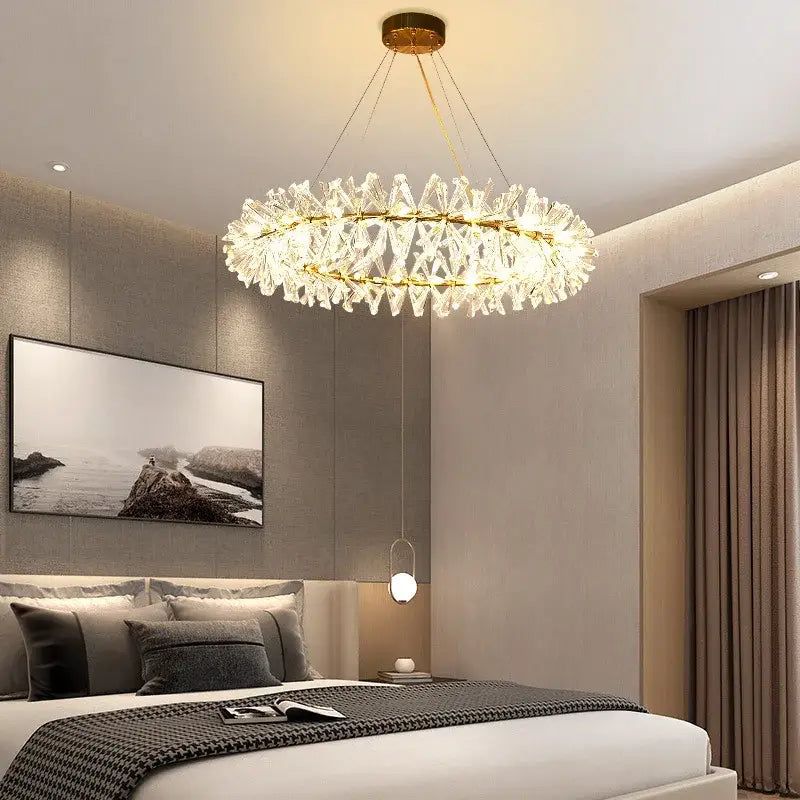 Modern gold metal wire crystal chandelier with concentric clear faceted crystals for dining room lighting