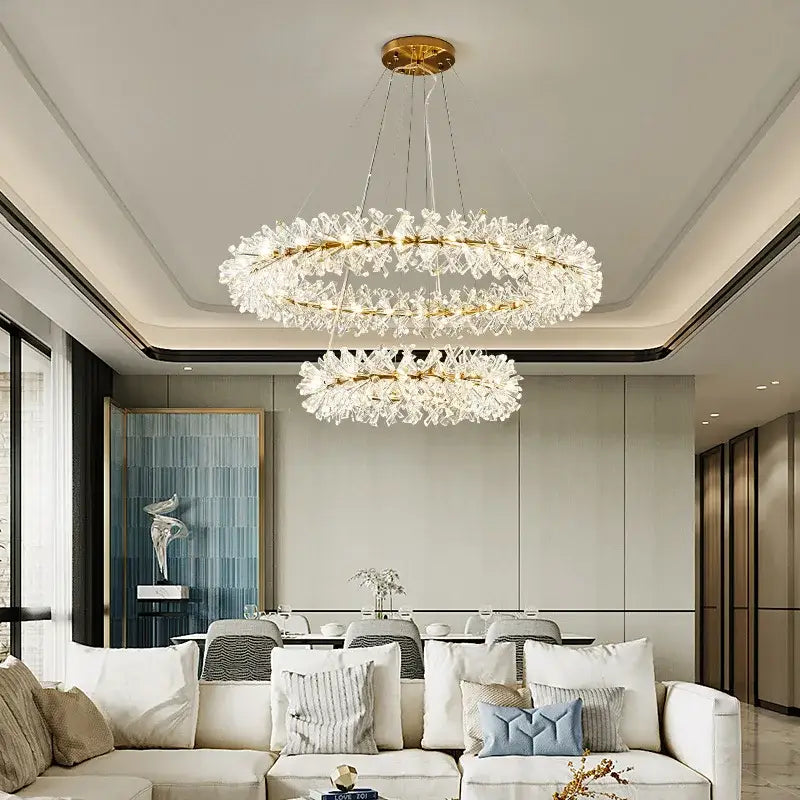 A modern gold metal wire crystal chandelier with clear elements and gold-toned metal accents for dining rooms