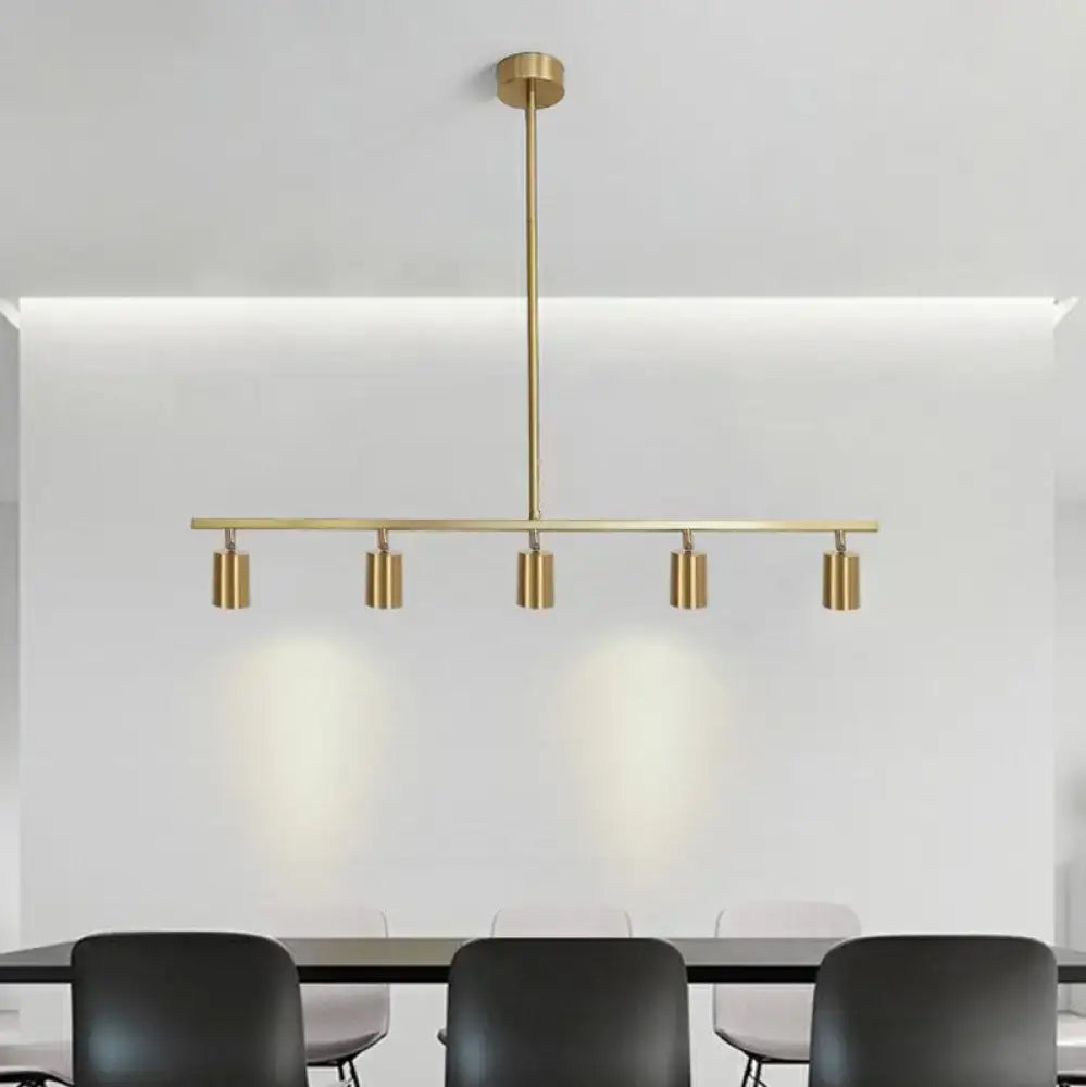 Modern brass pendant light with five cylindrical spotlights and a minimalist adjustable led tube shade for dining rooms