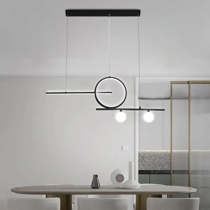 Modern black minimalist pendant light with globe acrylic shade and two spherical bulbs for dining room use