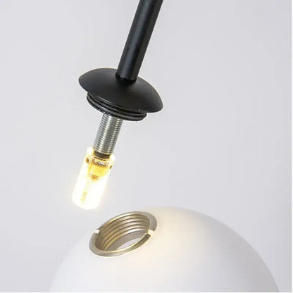 Black metal pendant light fixture with frosted white globe and exposed led bulb for modern gold minimalist iron chandelier decorbites black