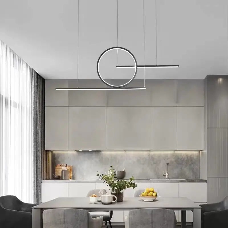 DecorBites™ minimalist LED island pendant light with sleek black halo ring suspended above dining room table