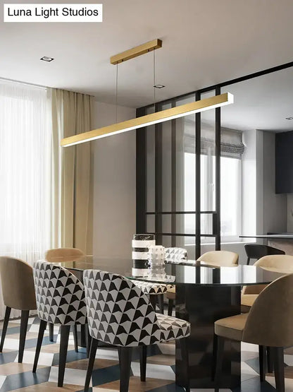 Modern gold minimalist led suspension lamp metal light fixture with linear design hanging above dining table