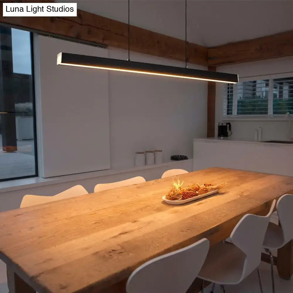 Modern black linear led suspension lamp metal light fixture with minimalist design hanging above dining table
