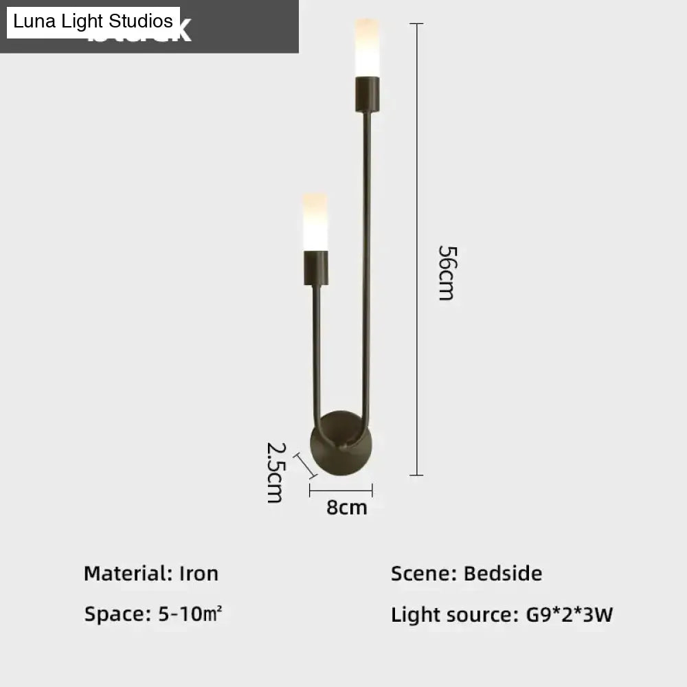 Modern black iron wall lamp with two upward-facing candle-style lights suitable as a led wall lamp