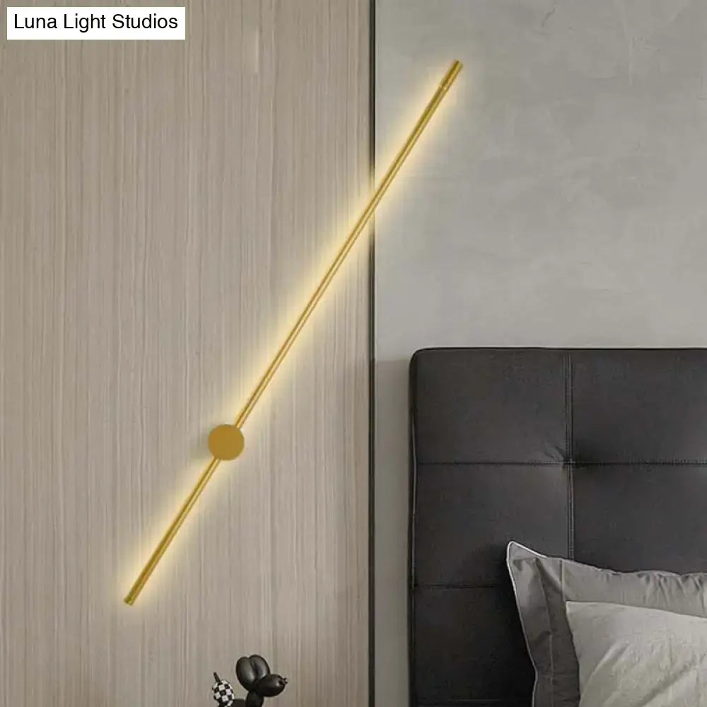 Modern gold minimalist led wall light with a gold-toned linear design and fixture height 57 for bedroom use