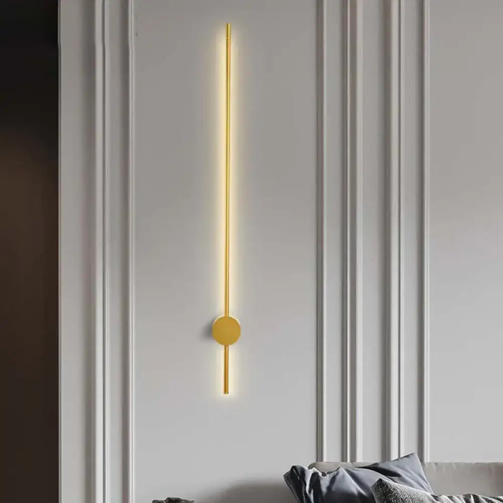 Modern gold minimalist led wall light with a sleek vertical rod and fixture height 57 emitting warm light