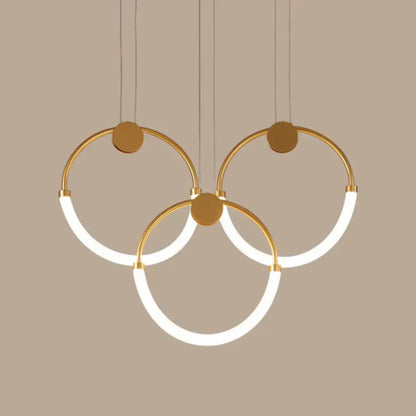 Modern gold minimalistic ring pendant light with illuminated white led rings for living room lighting