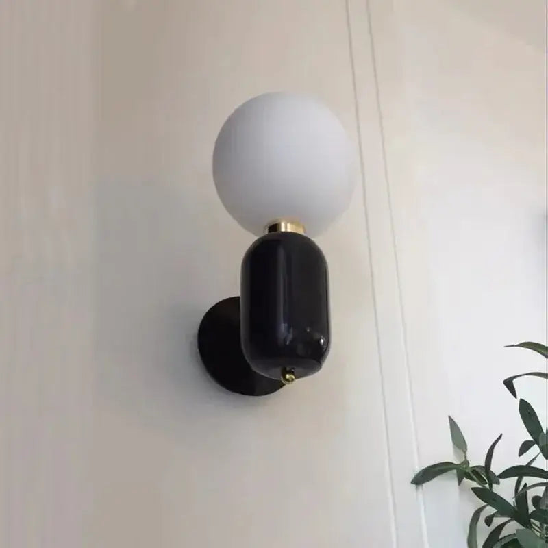 Black and white spherical wall lamp with a matte finish decorbites gold mirror ball wall lamp for modern decor