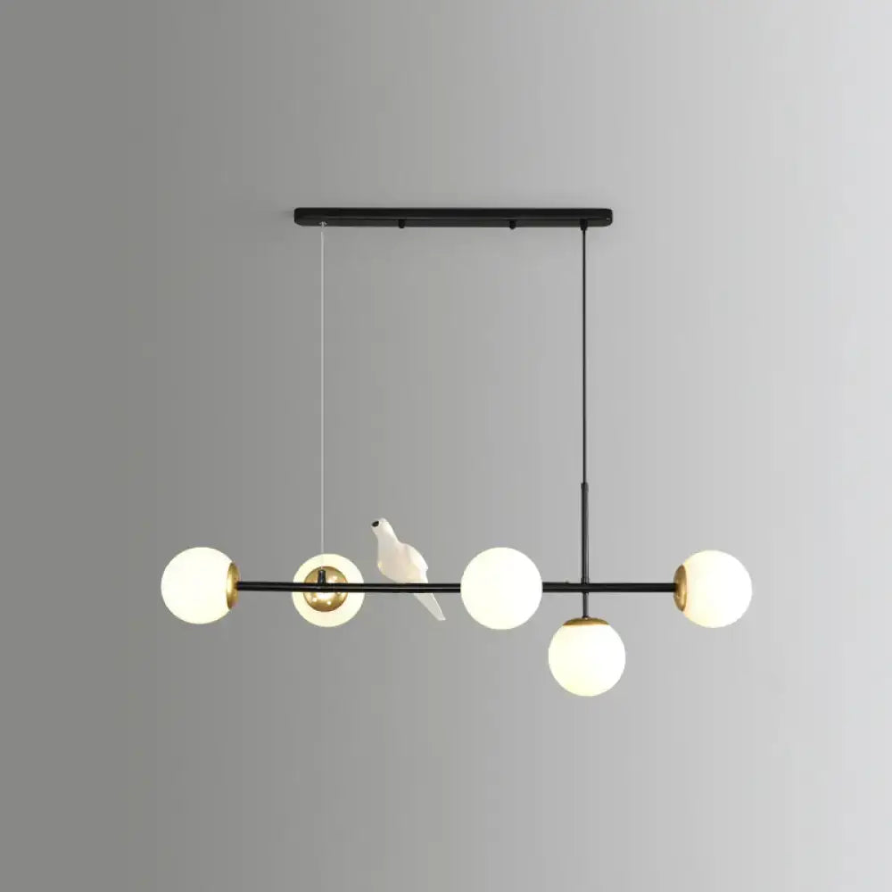 DecorBites™ modo island 5-light pendant light with gold black brass and milk white frosted glass globes for restaurants