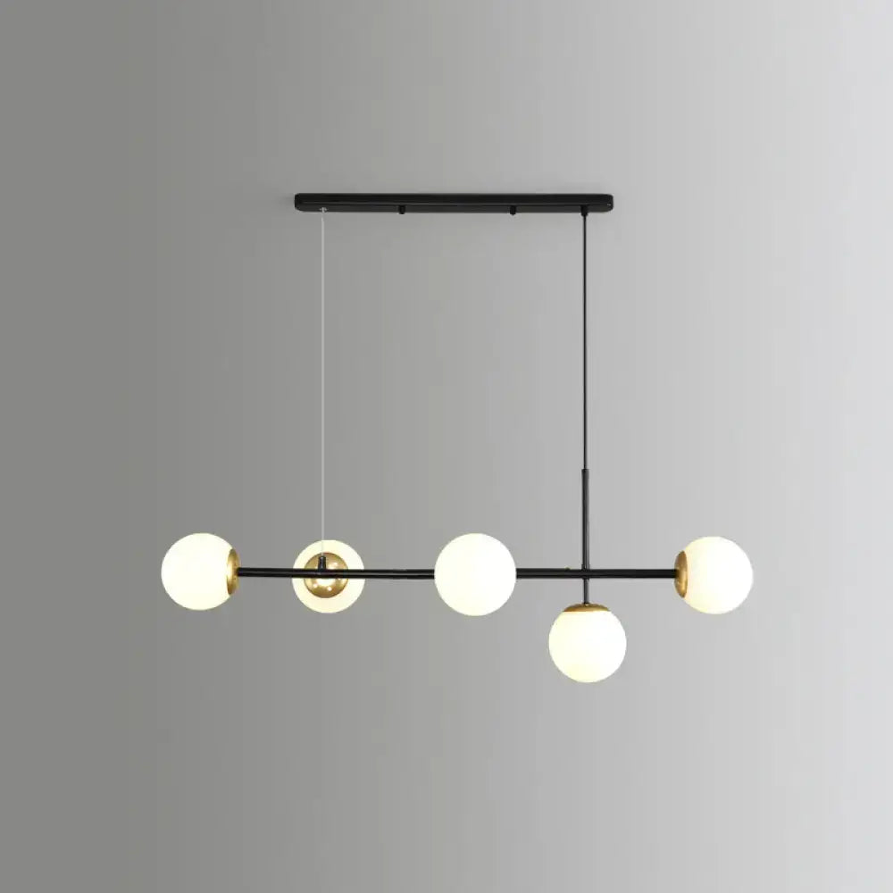 Decorbites modo island 5-light pendant light features gold black brass and milk white frosted glass globes for restaurants