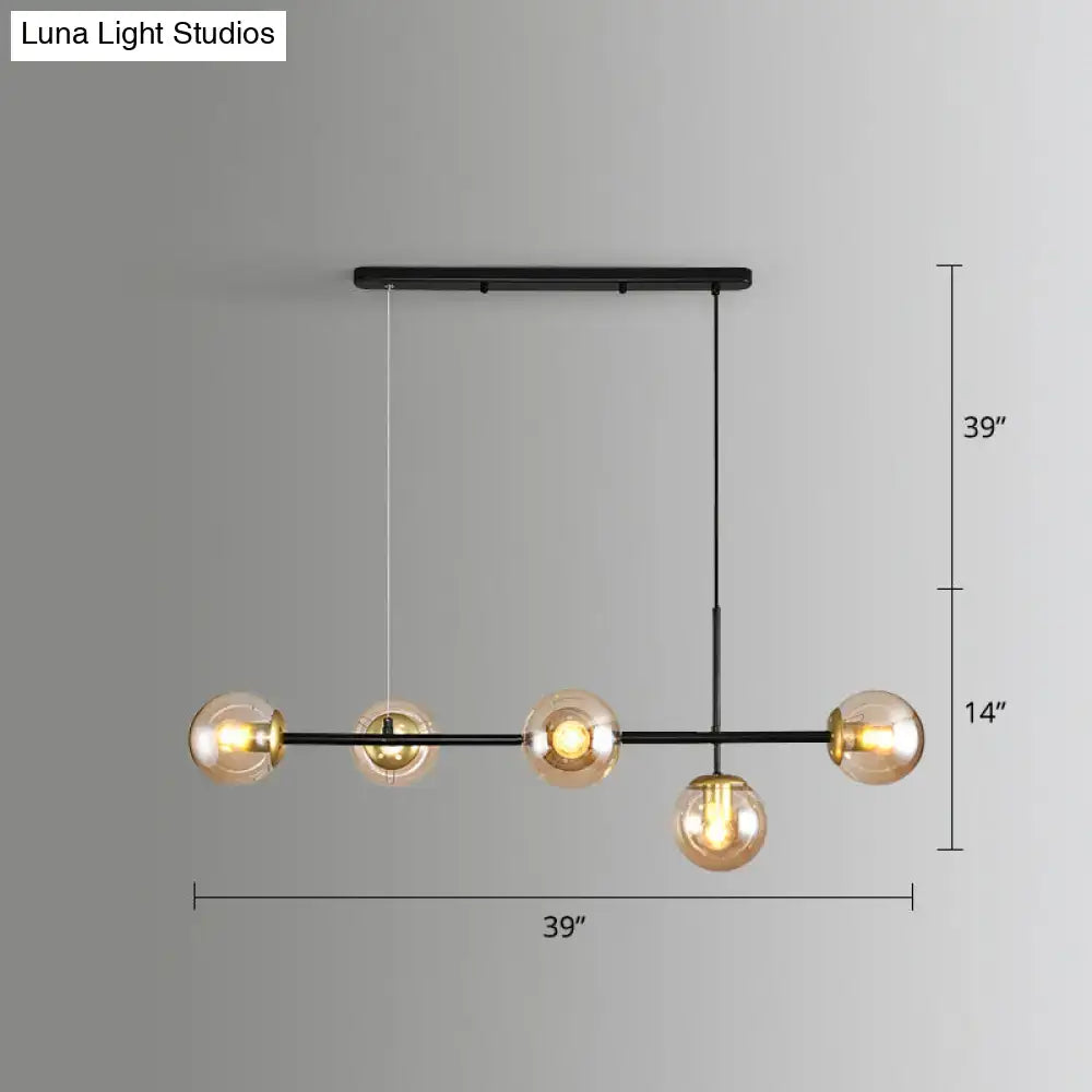 Decorbites modo island glass 5-light pendant light with black metal frame and amber globes ideal for restaurants