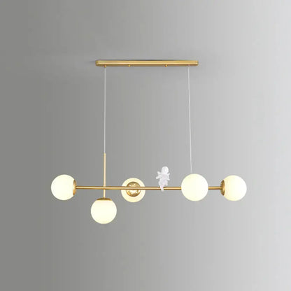 Decorbites modo island gold-toned pendant light with five milk white frosted glass globes and central angel figurine