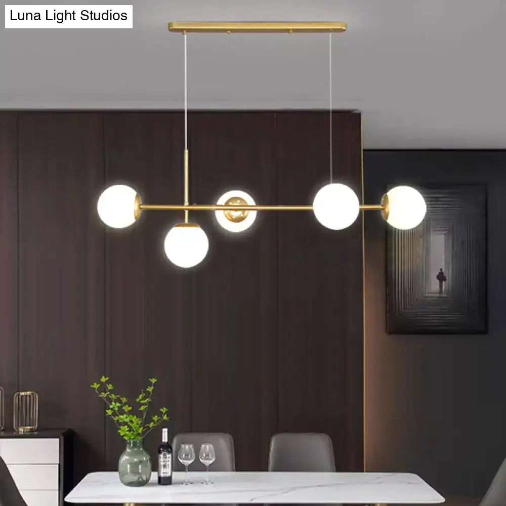 Decorbites modo island 5-light pendant light with gold-toned metal and milk white glass bulbs for restaurants