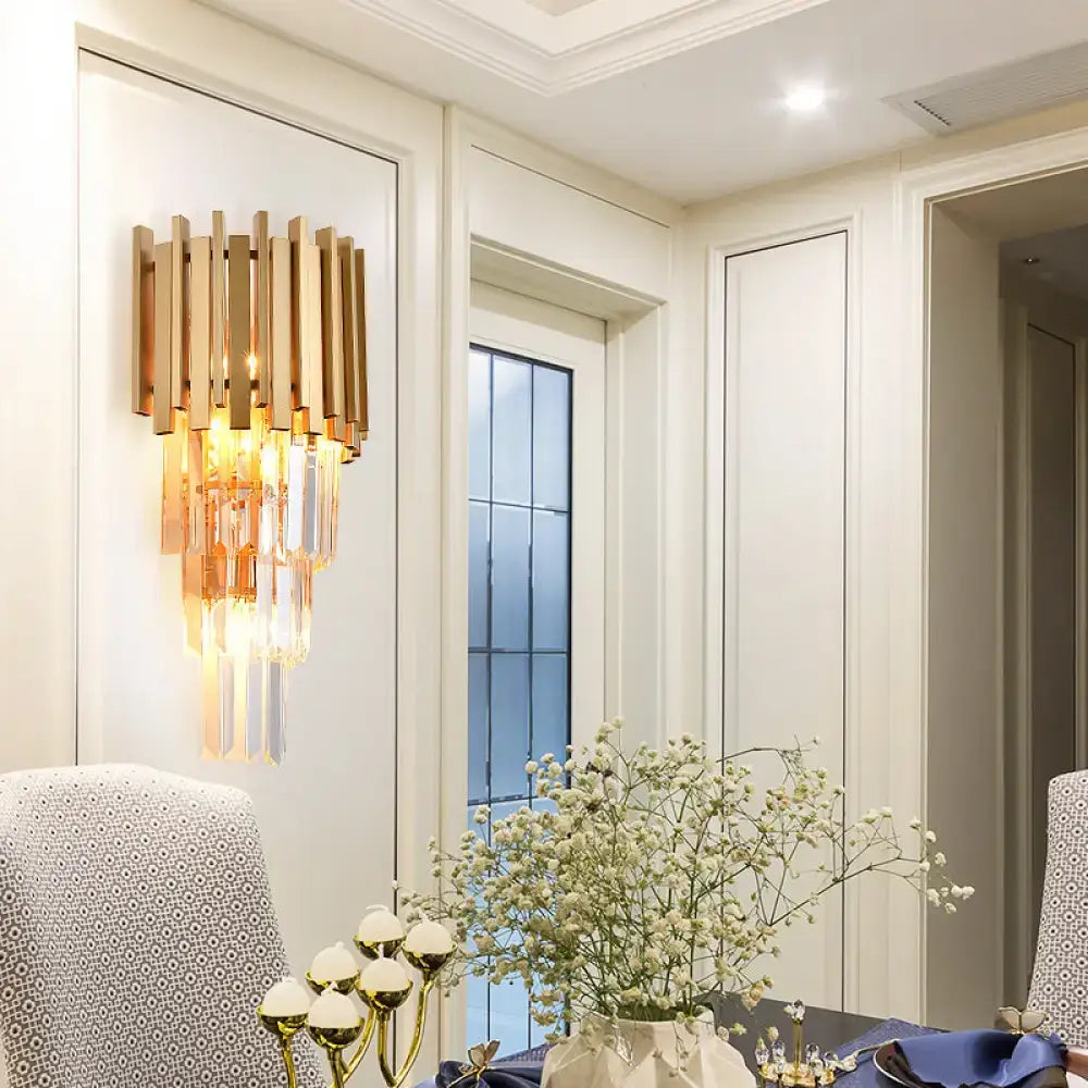 Modern gold wall light with vertical brass bars and cascading crystal prism tiers for dining room wall lamp